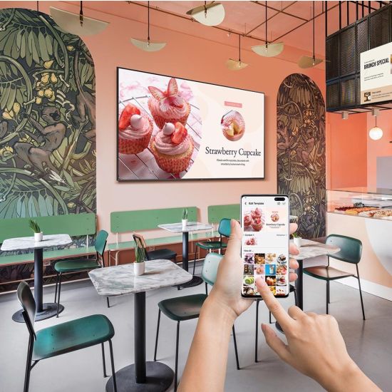 Two elegant, black, freestanding digital displays showing QR codes on a polished wooden table in a high-end, modern restaurant with ambient lighting, professional product photography.